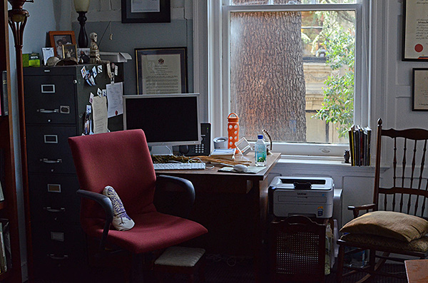 View of desk & chairs in front of window