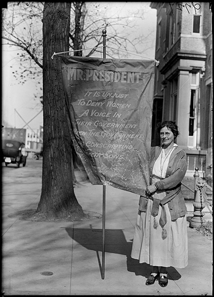 Suffragist with banner