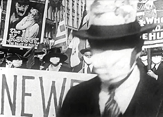 Influenza masks, 1918. Video still from footage by Gould, courtesty the Prelinger Archives.