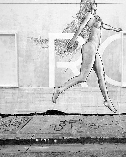 Photograph of street art of a woman.