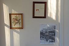 Three images on the wall under the Kossier broadside.