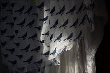 Close-up of scarf with repeatig blackbird pattern.