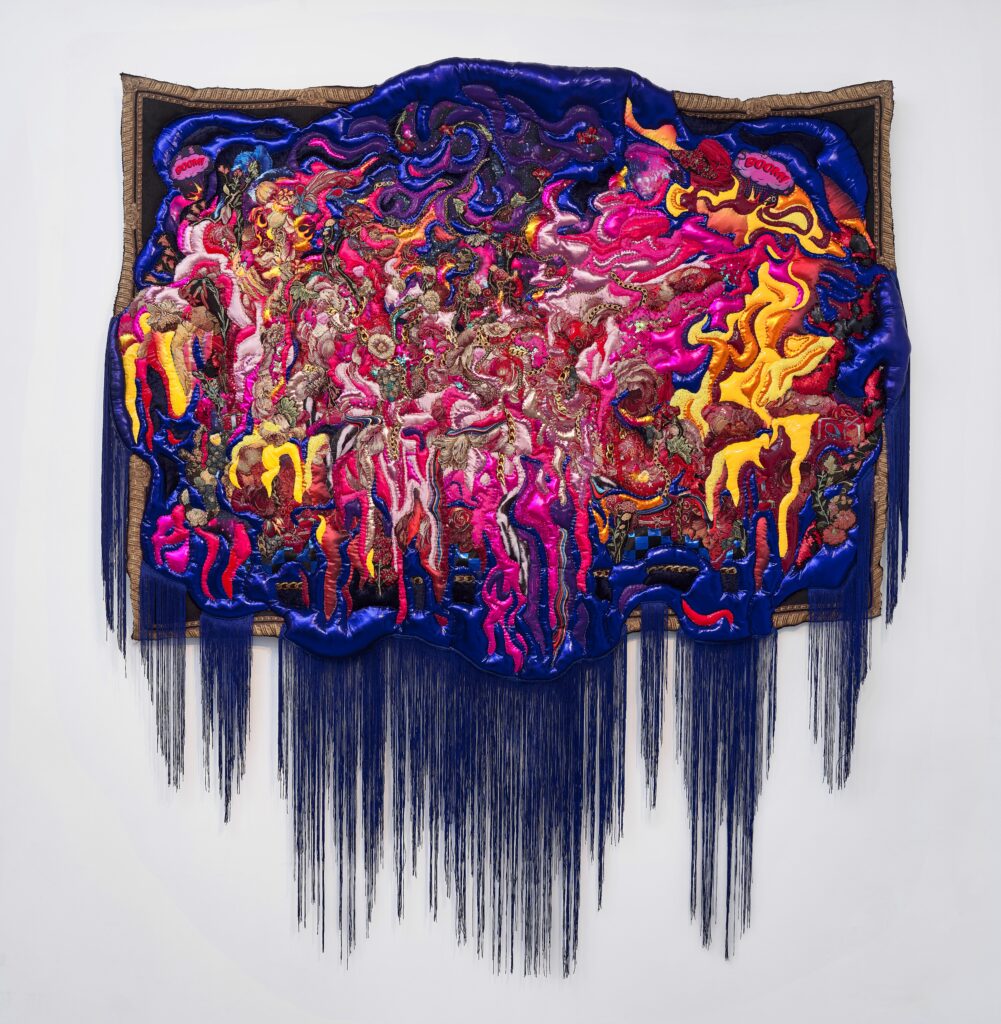 In a roughly rectangular shape, many colors and textures of fabrics come together, including many shades of pink, dark purples, and bright yellows. Fabrics include "LOVE" and "KISS" candy hearts, gold chains, and flowers. The majority of the image is in a more organic shape, while a rectangular shape surrounds it evoking a frame.