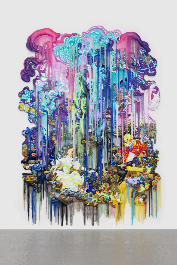 Fabrics in purples, pinks, and blues, with fringe coming down, seem to create clouds above a scene, also crafted in various fabrics, of a woman in a dress.