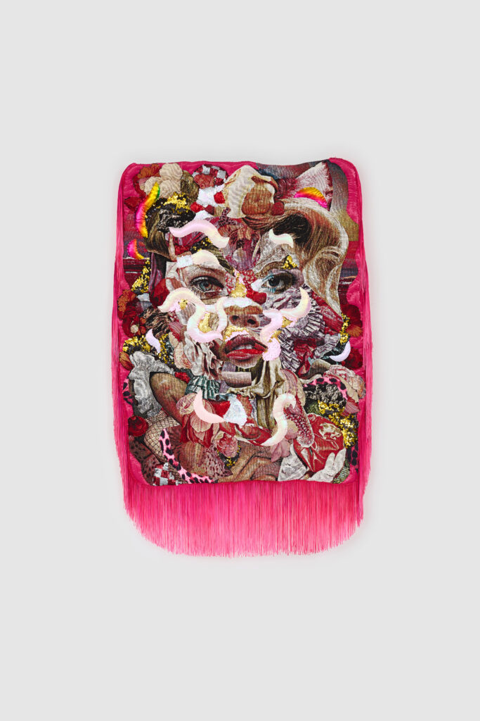 Woman's facial features emerge from collage of fabrics in multiple colors and patterns, surrounded by hot pink fringe.